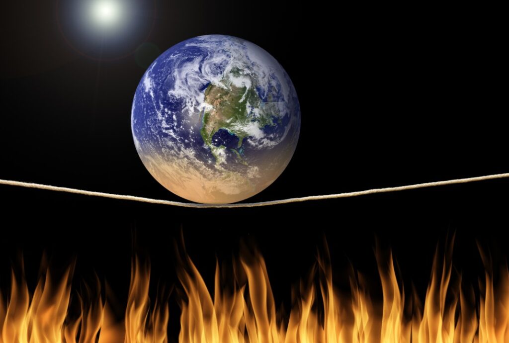 Earth on tightrope above flames